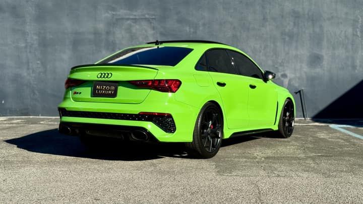 Green Audi RS3 rental in Los Angeles, rear three-quarter view