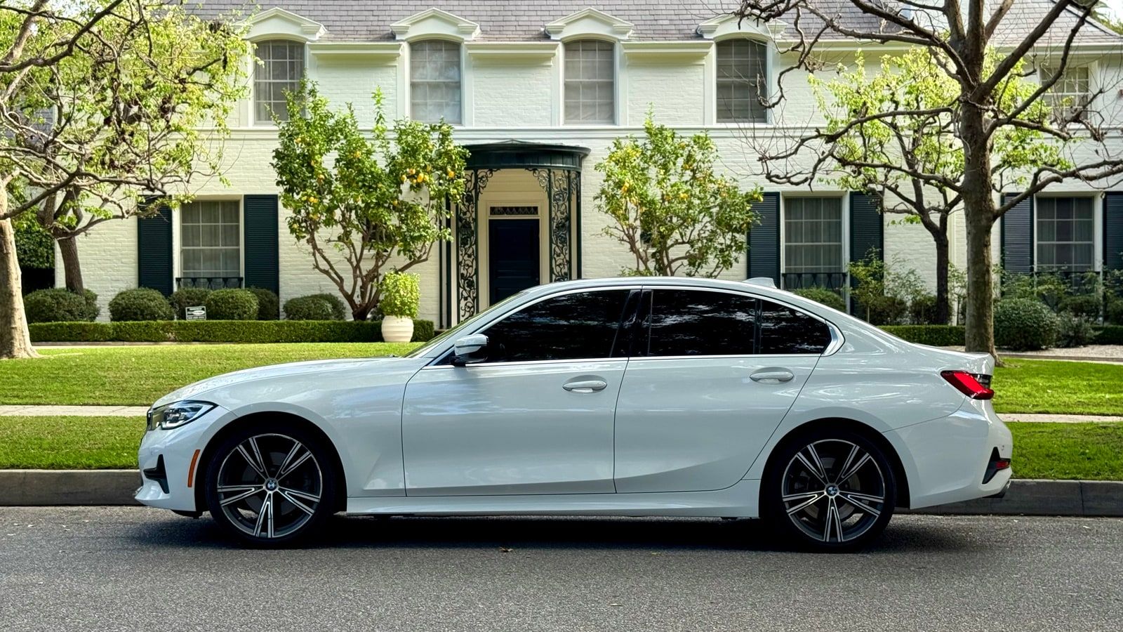 White BMW 3 Series in profile