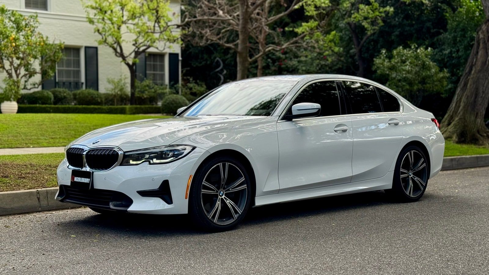 White BMW 3 Series from a front three-quarter