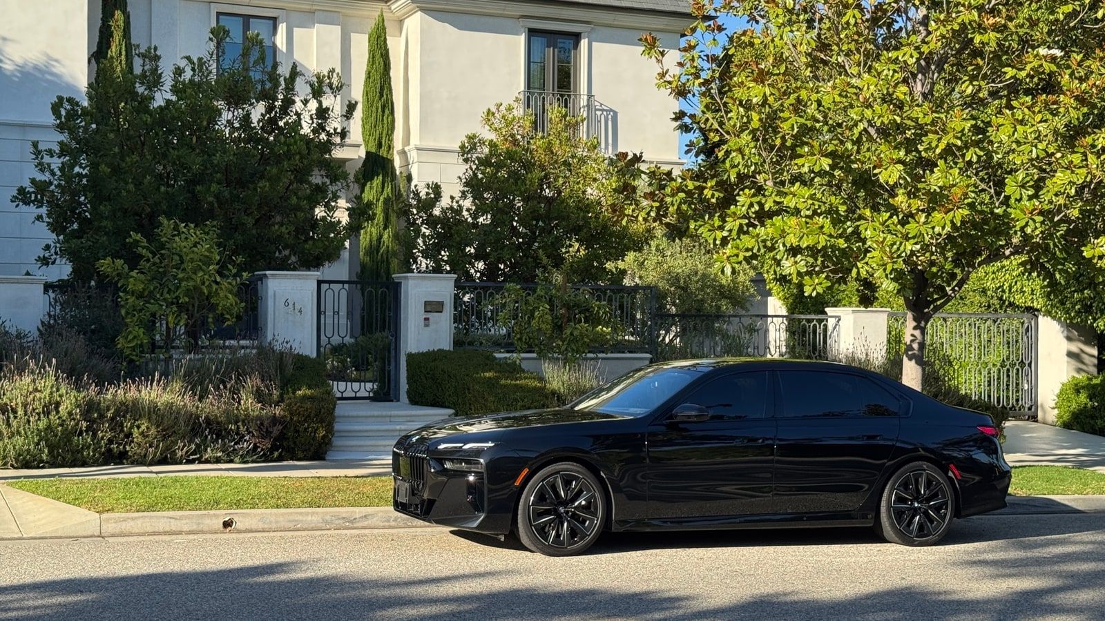 Black BMW 7 Series saloon on a Los Angeles street, front three-quarter view