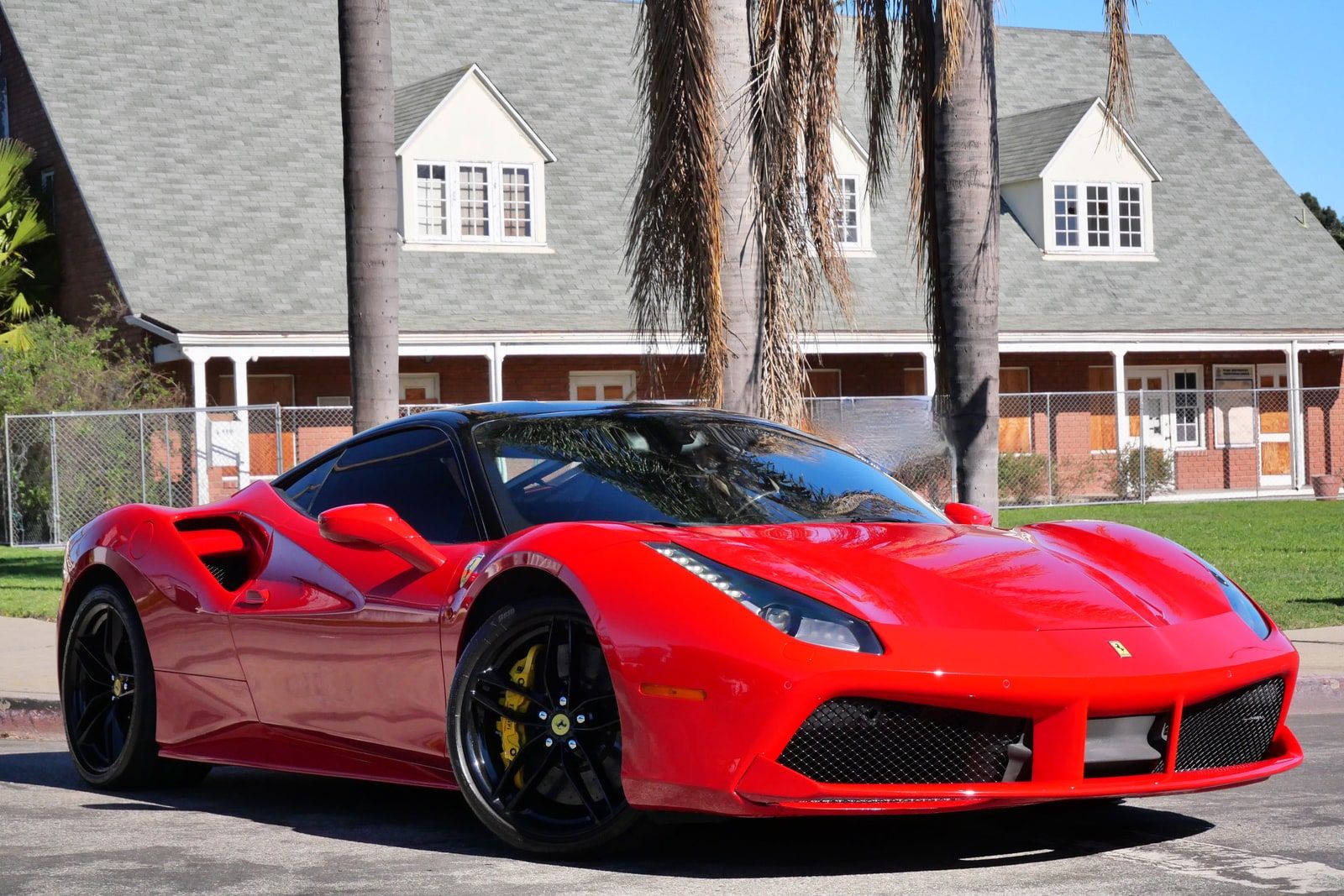 Red Ferrari 488 GTB seen from a tight front three-quarter angle