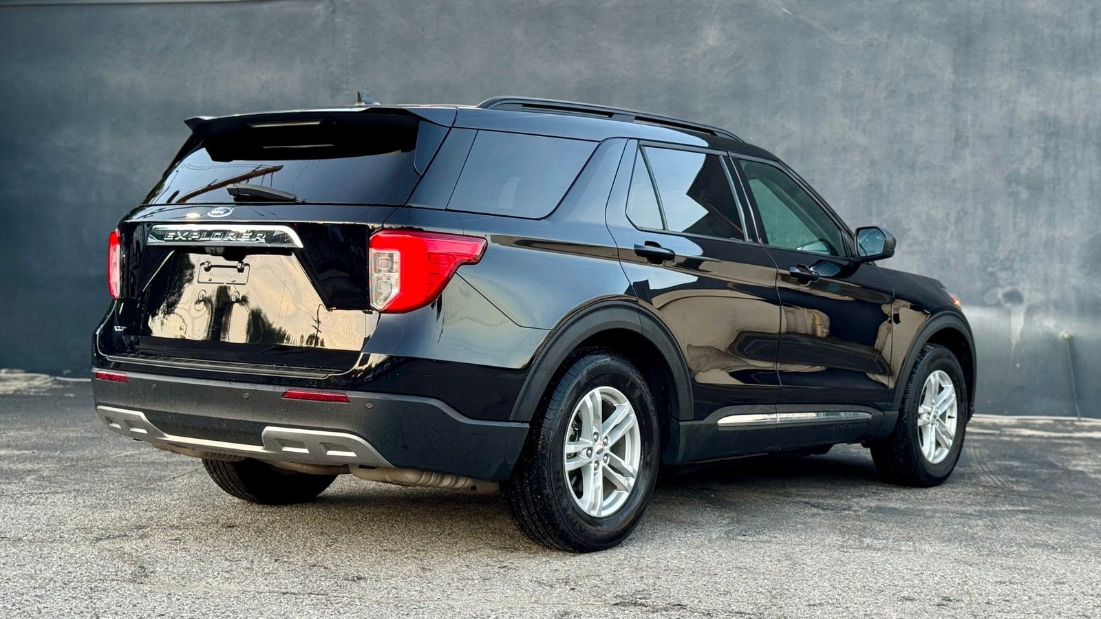 Black Ford Explorer from the rear three-quarter