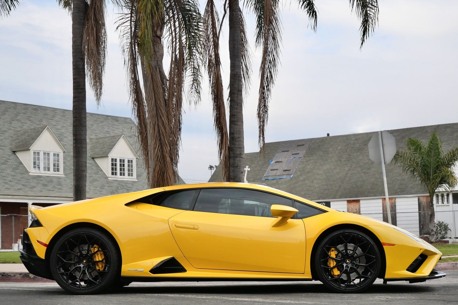 Yellow Lamborghini Huracán Evo low on a Los Angeles street, front splitter close to the ground