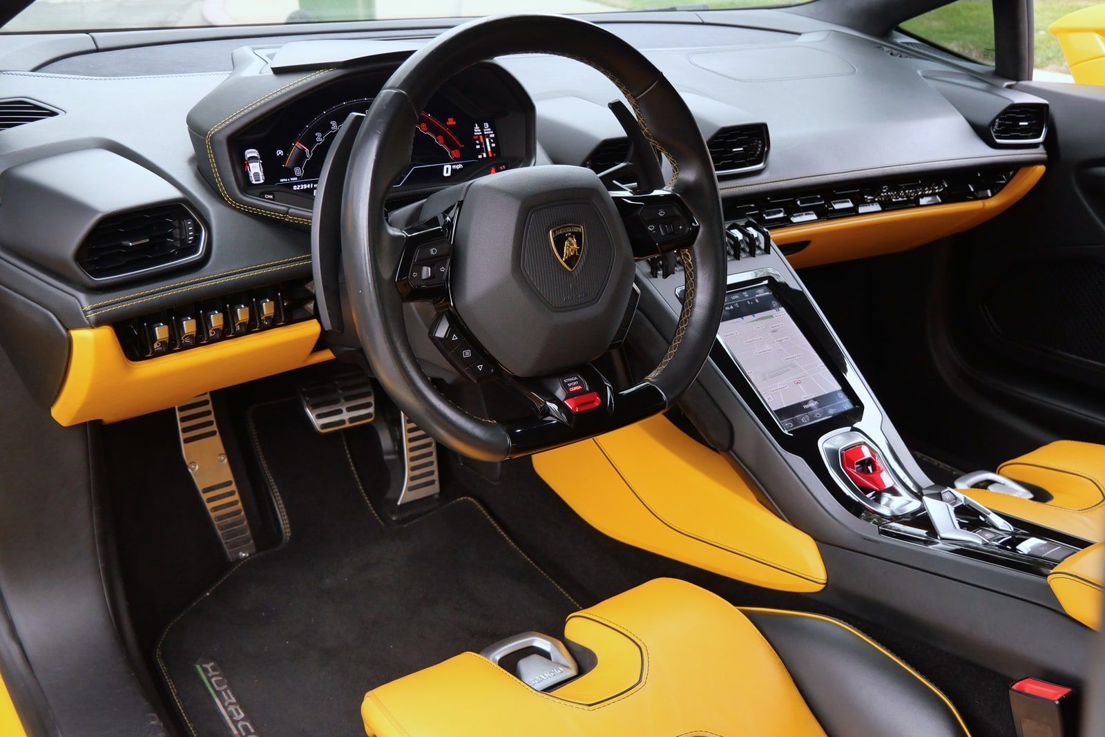 Yellow Lamborghini Huracán Evo from the front three-quarter on a Los Angeles street