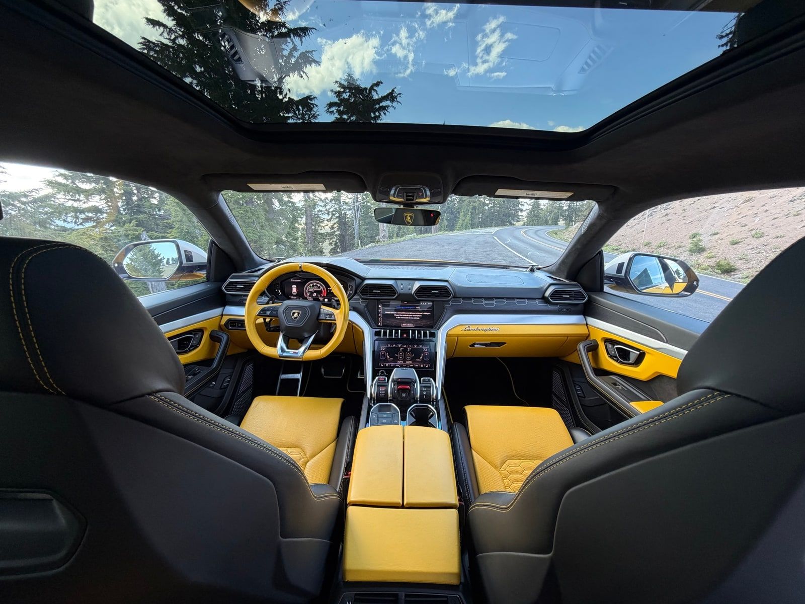Yellow Lamborghini Urus on a Los Angeles street, front three-quarter view
