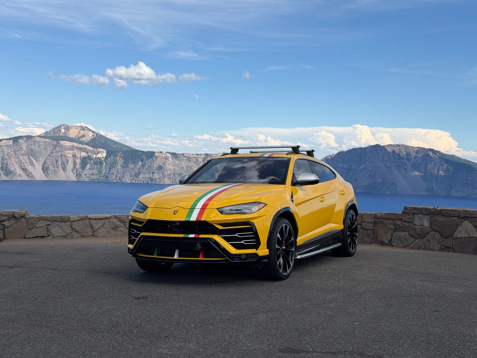Yellow Lamborghini Urus available to rent in Los Angeles, front three-quarter view