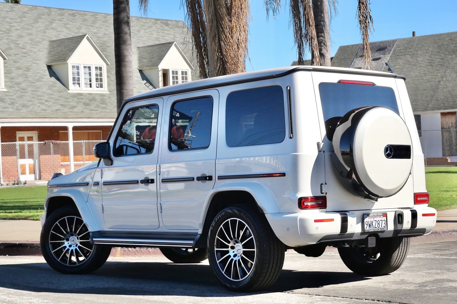 White Mercedes G 550 on a residential Los Angeles street, front three-quarter view