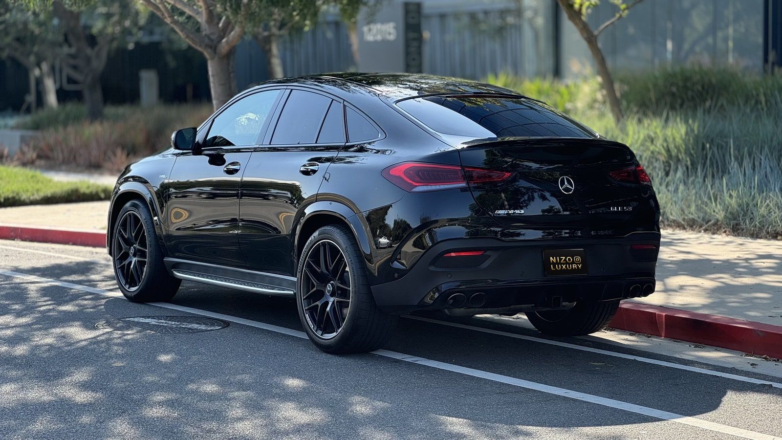 Black Mercedes-AMG GLE 53 from the rear three-quarter