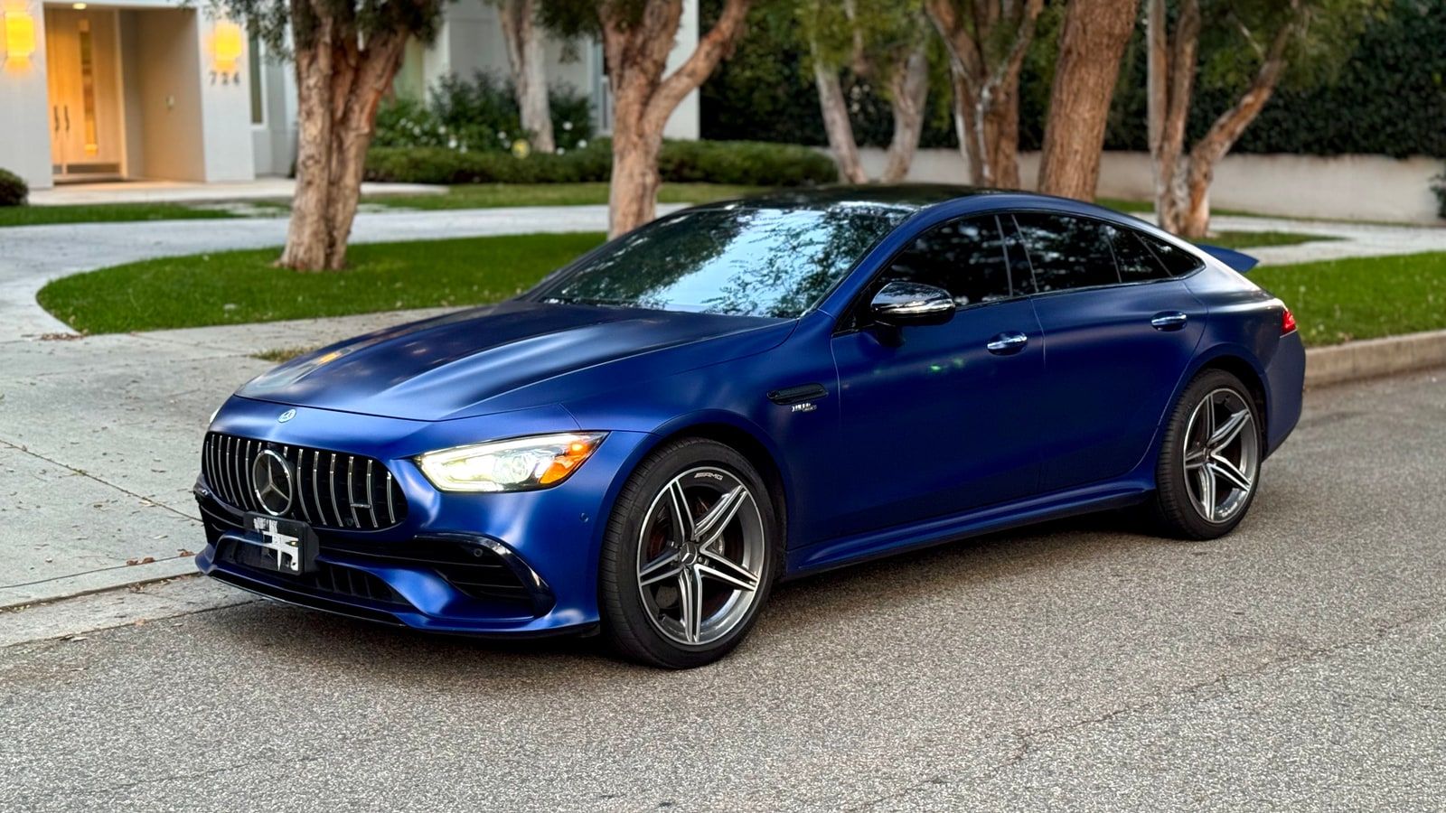 Blue Mercedes-AMG GT 43 from a low front three-quarter