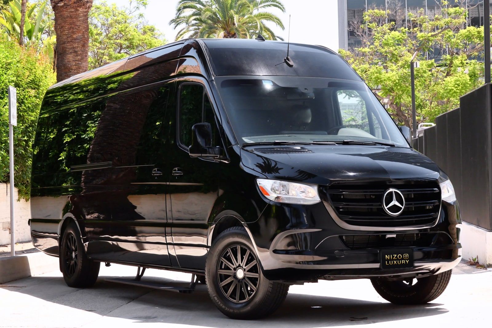 Black Mercedes Sprinter passenger van on a Los Angeles street