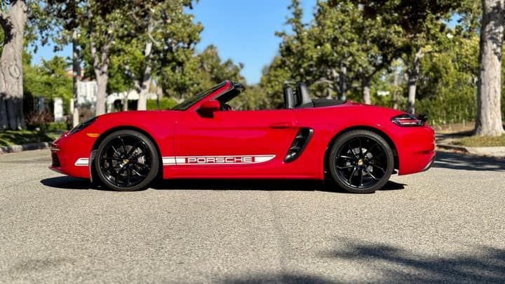 Red Porsche 718 Boxster convertible rental in Los Angeles, front three-quarter view